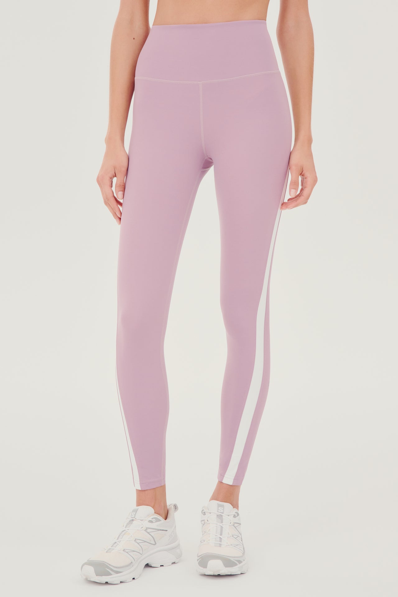 A woman's Miles High Waist Rigor 7/8 leggings in Blush and White, perfect for yoga by SPLITS59.
