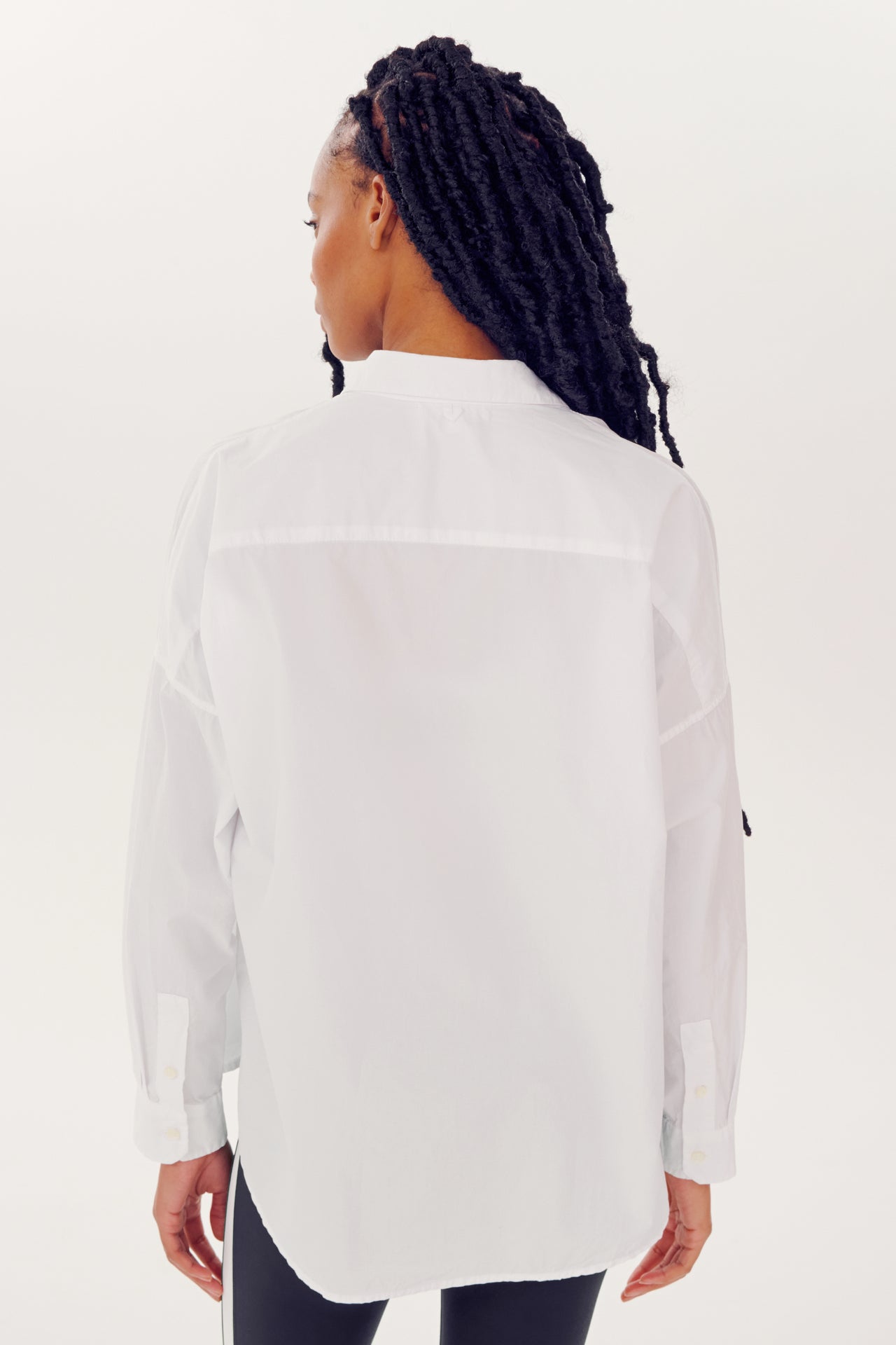 Woman wearing an Alex Mill x Splits59 Jo Shirt in White, viewed from behind.