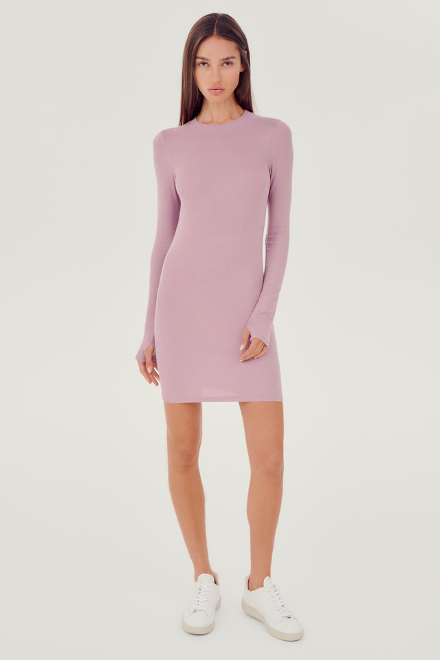 The model is wearing a SPLITS59 Louise Rib Long Sleeve Dress in lilac.