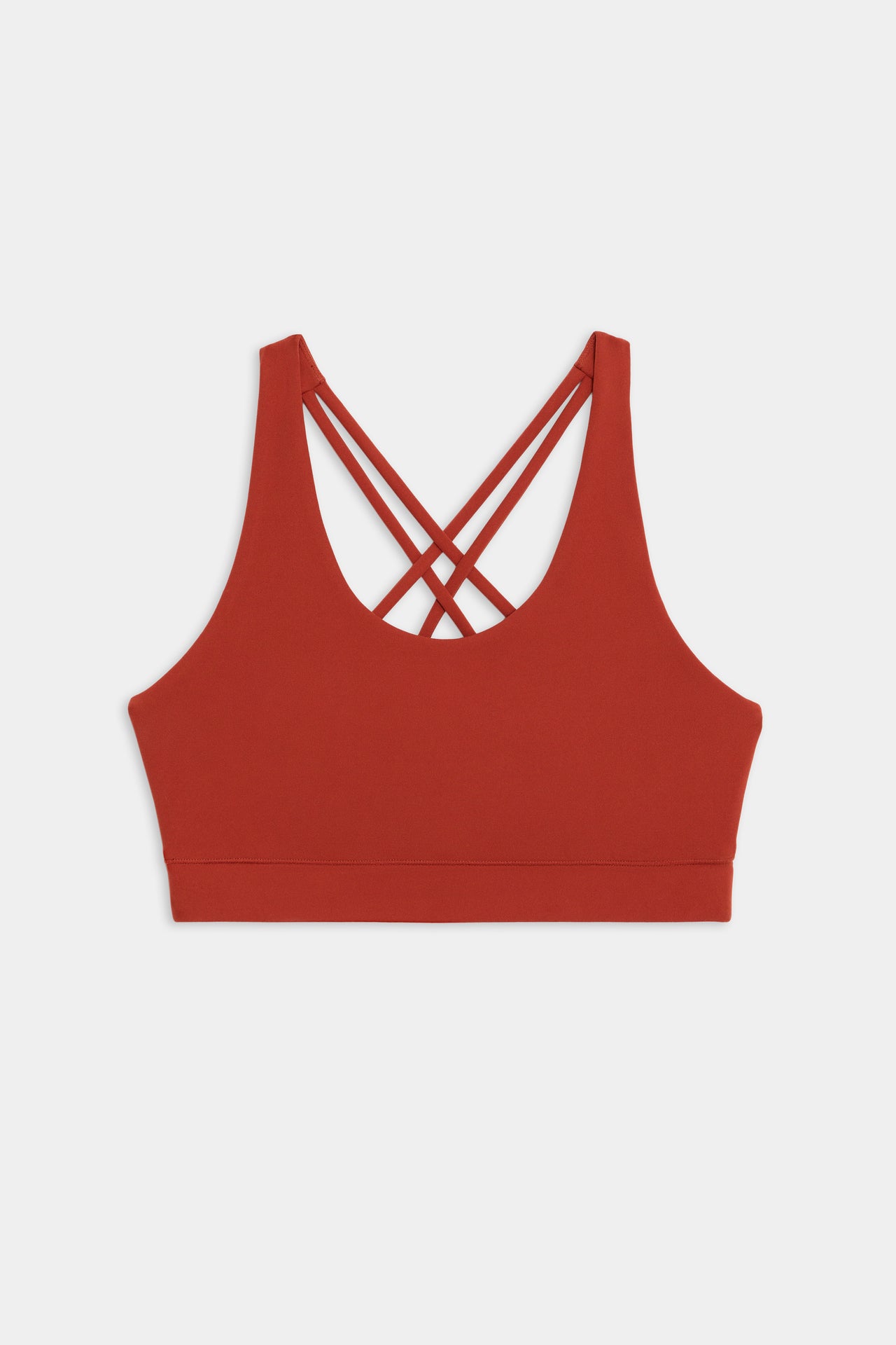 Flat view of red sports bra with thick straps and 4 criss crossed spaghetti straps