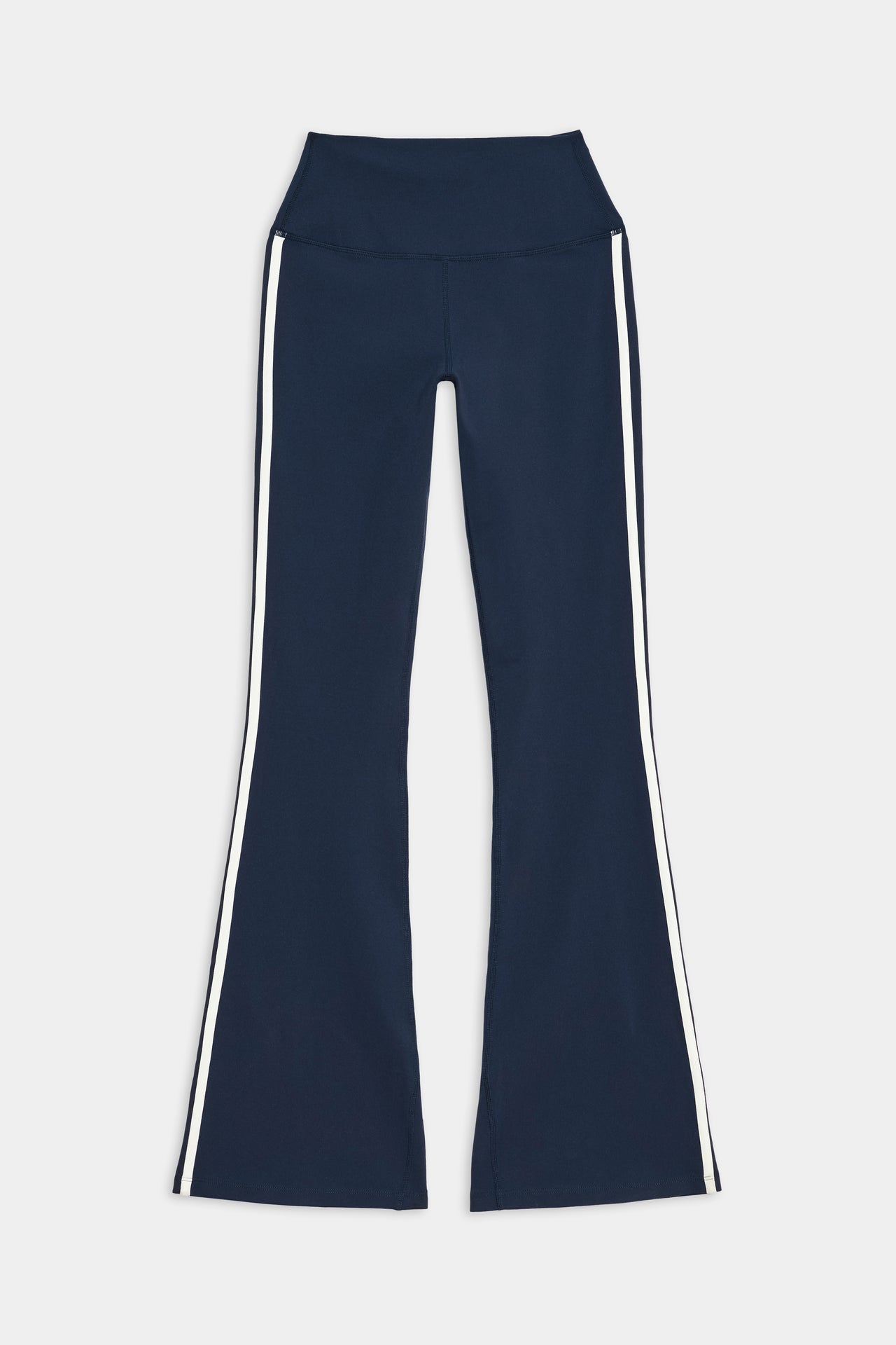 Front side view of dark blue high waist below ankle length legging with wide flared bottoms and white double side stripes on both legs and white and side black stripes on both legs