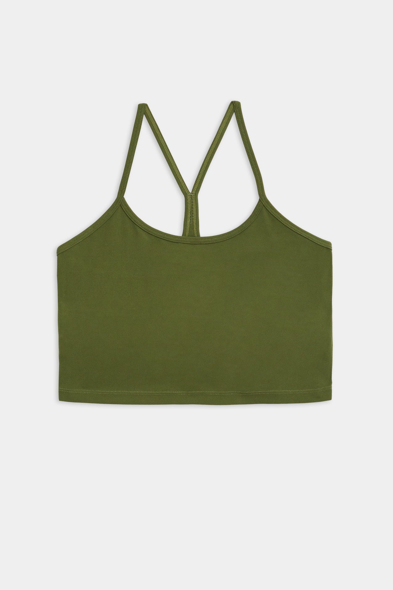 A green, strappy sleeveless crop top made from a blend of nylon and spandex fabric is displayed on a white background. The product name is 