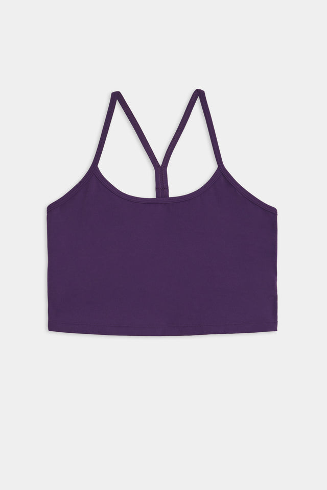 Airweight Crop - Black Currant, crafted from a comfortable blend of spandex and nylon, featuring thin crisscross shoulder straps. Photographed against a white background.