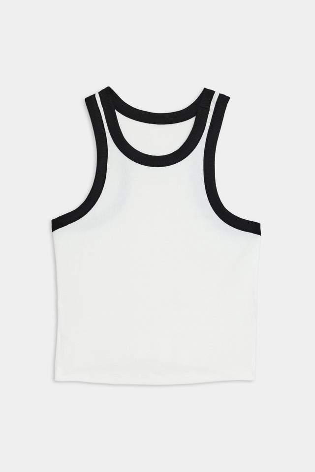 A SPLITS59 Kiki Rib Crop Tank - White/Black made from soft modal with spandex, featuring black trim around the neck and armholes, laid flat against a plain background.