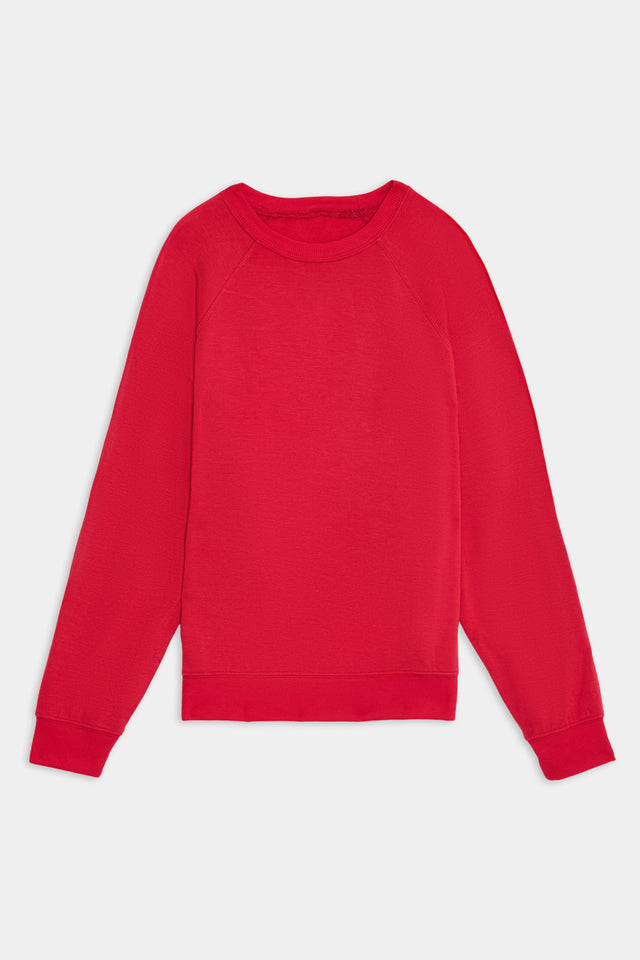 A plain red long-sleeve sweatshirt, the Andie Fleece Sweatshirt - Pirate Red by SPLITS59, crafted from a soft fabric blend, featuring a crew neck and displayed against a white background.