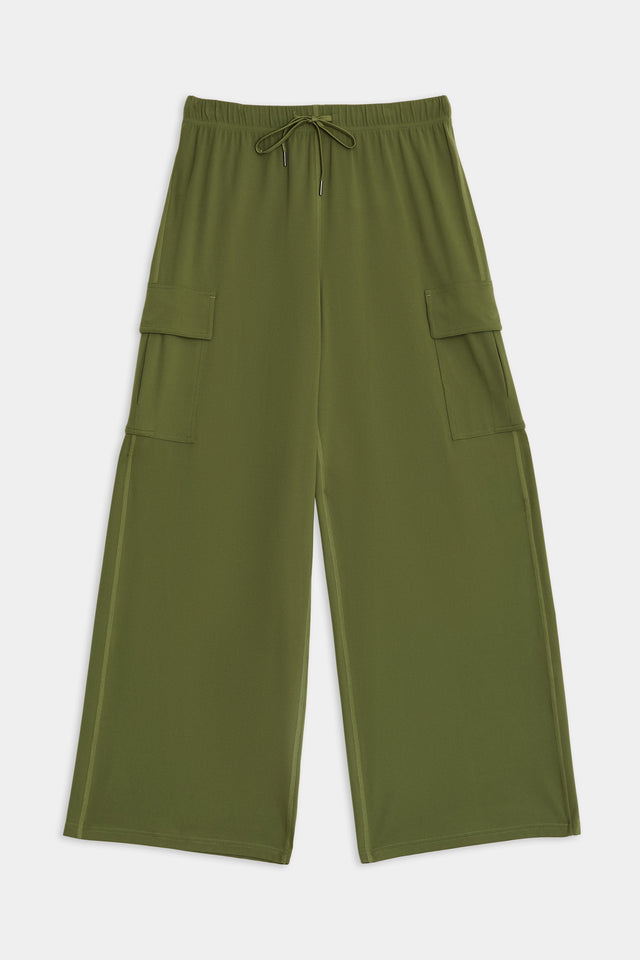 Alex Airweight Cargo Pant - Olive by SPLITS59 with a drawstring waist and large side pockets, made from a comfortable blend of nylon and spandex, displayed on a flat surface.