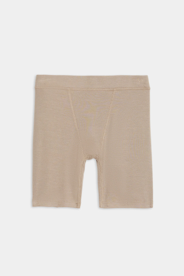 A Theo Rib Short - Latte by SPLITS59, with an elastic waistband, made from a soft blend of 95% modal and 5% spandex, laid flat on a plain white background.