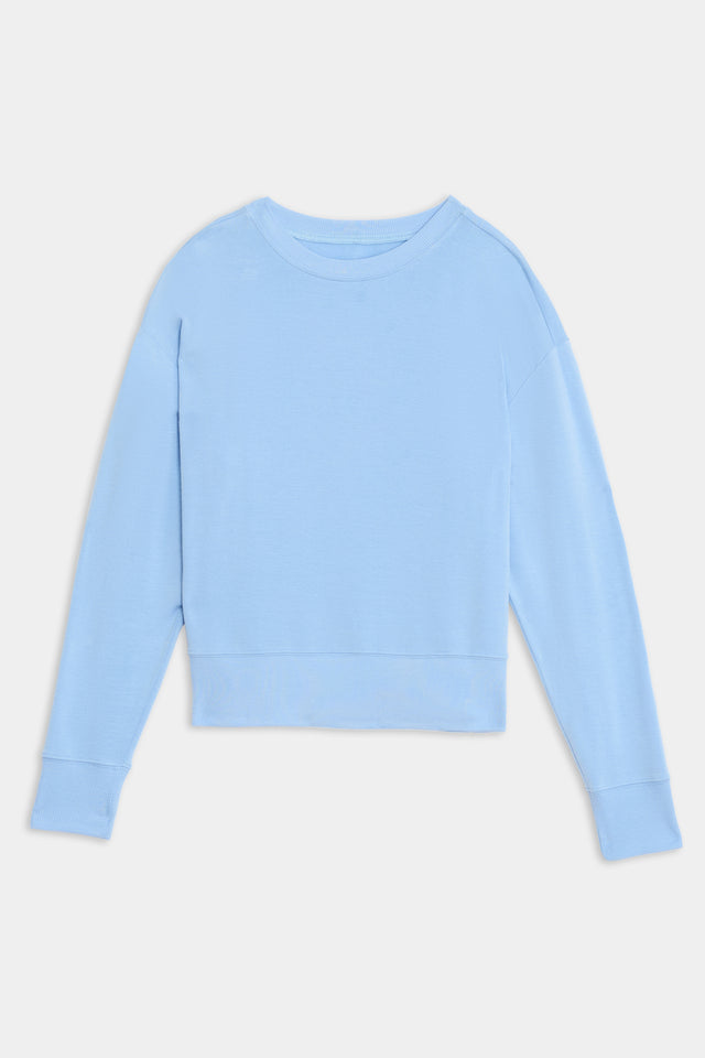 Light blue, long-sleeved, crew neck Sonja Fleece Sweatshirt - Skylight from SPLITS59 made from a cozy blend of modal fabric on a white background.