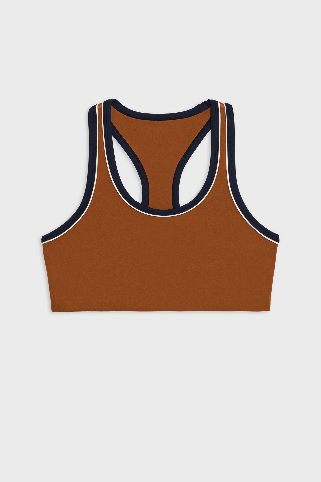 Front flat view of dark orange bra with white and dark blue border arm and neckline and racerback