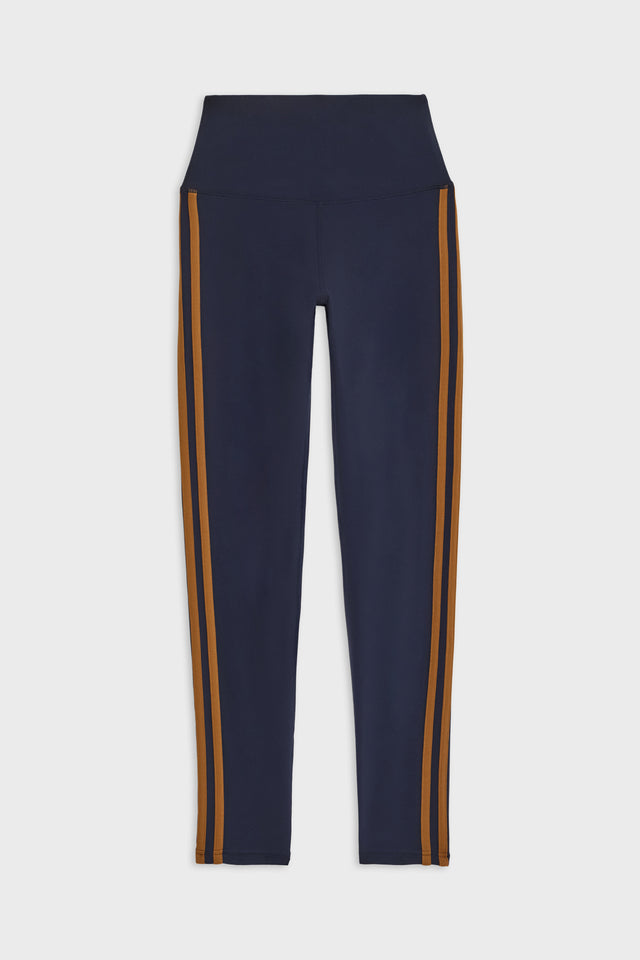 Flat view of dark blue leggings with two brown stripes down the side