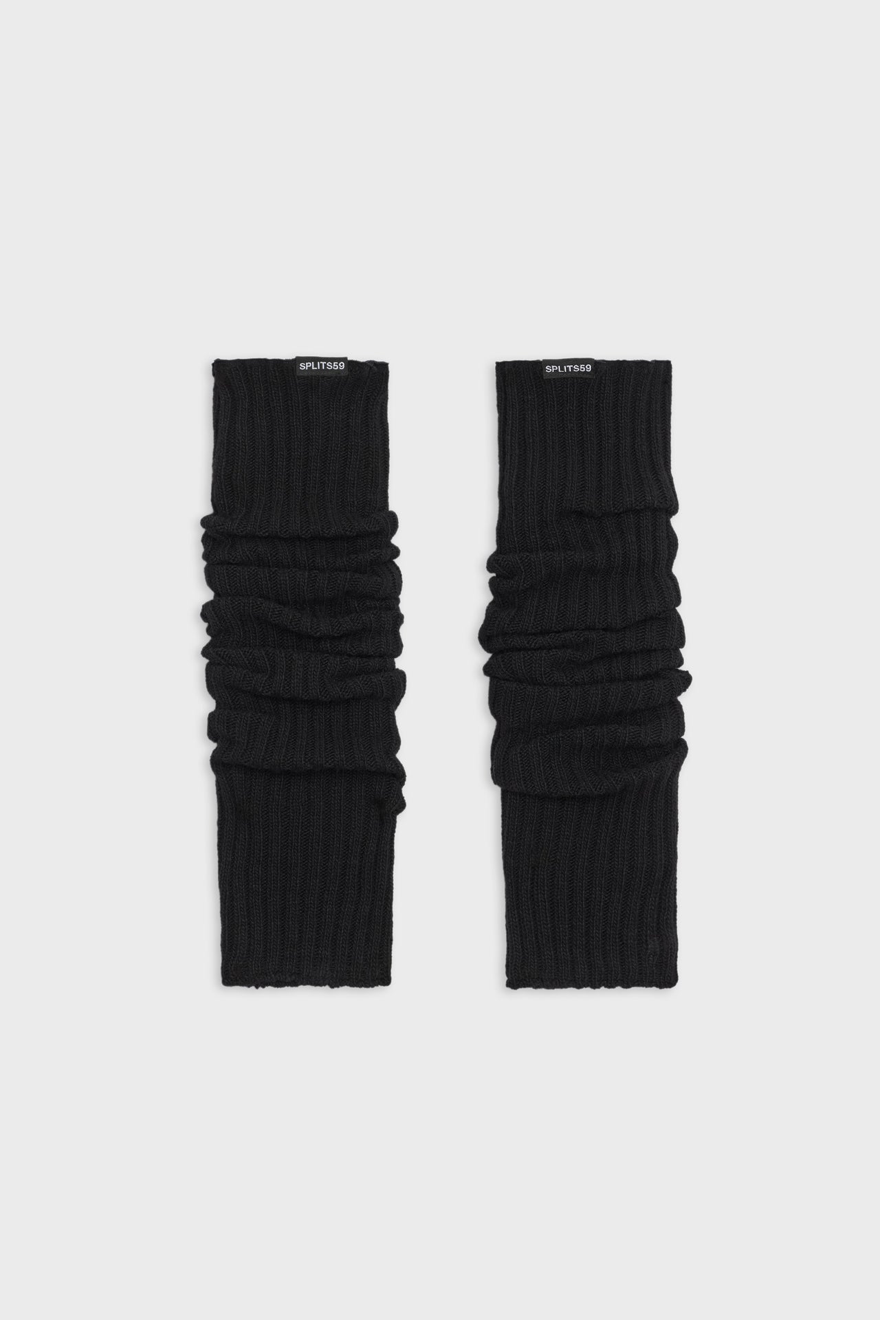 A pair of SPLITS59 black leg warmers on a white background.