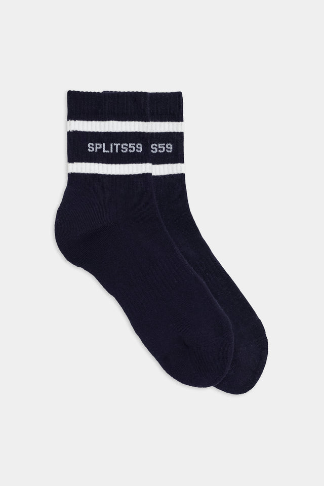 A pair of dark blue vintage sport athletic socks with white stripes and the text 