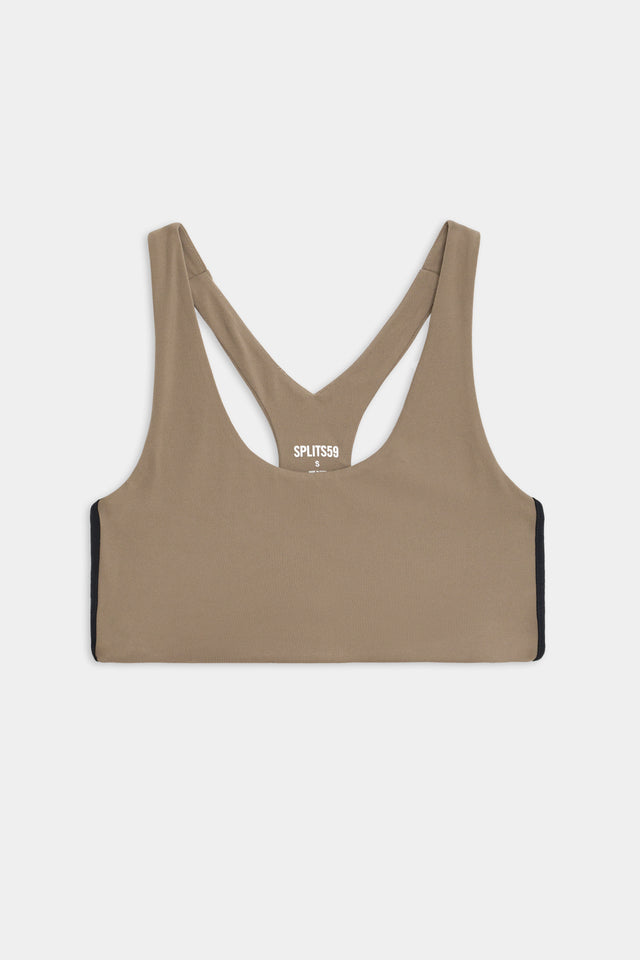 Full flat view of light brown sports bra with two black stripes down the side