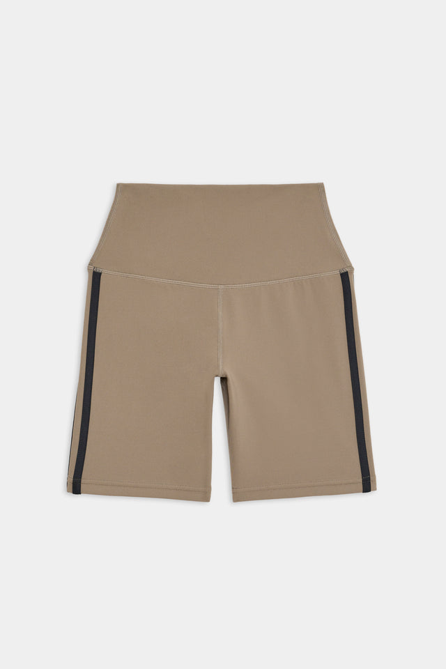 Flat view of light brown bike shorts with two black stripes down the side
