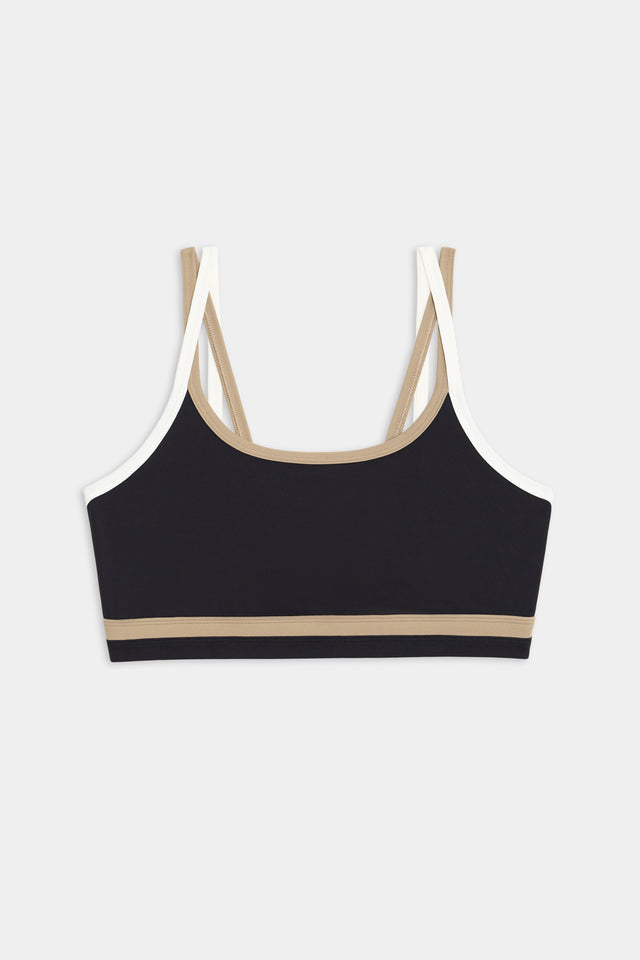 The SPLITS59 Eva Rigor Double Strap Bra in Black/Latte features stylish beige and white straps, ideal for comfortable gym workouts.