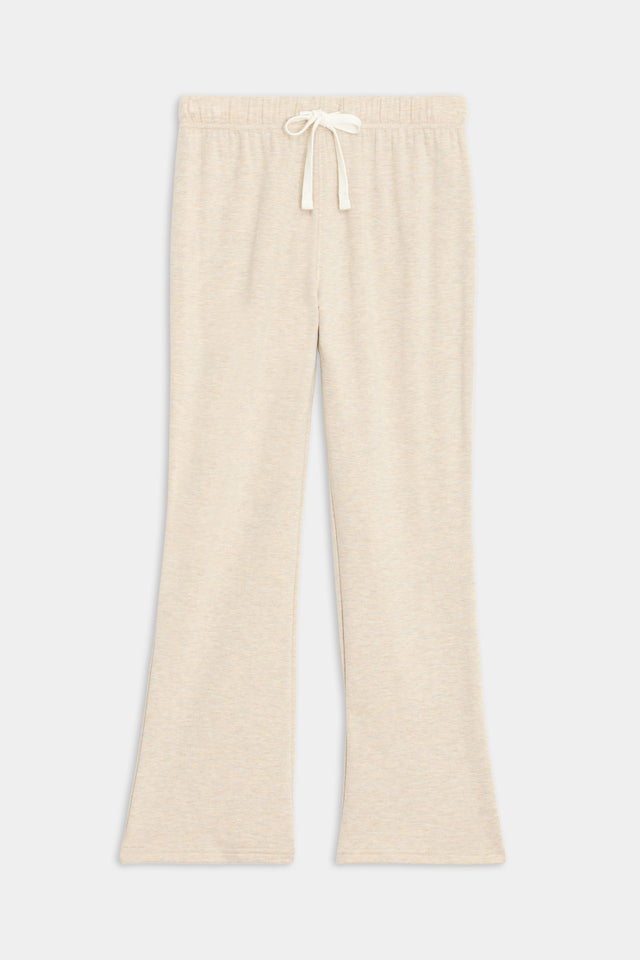 The Brooks Fleece Cropped Flare in Heather Oatmeal by SPLITS59 are beige wide-leg pants with an adjustable drawstring waist, made from ultra-luxe fleece, displayed on a white background.