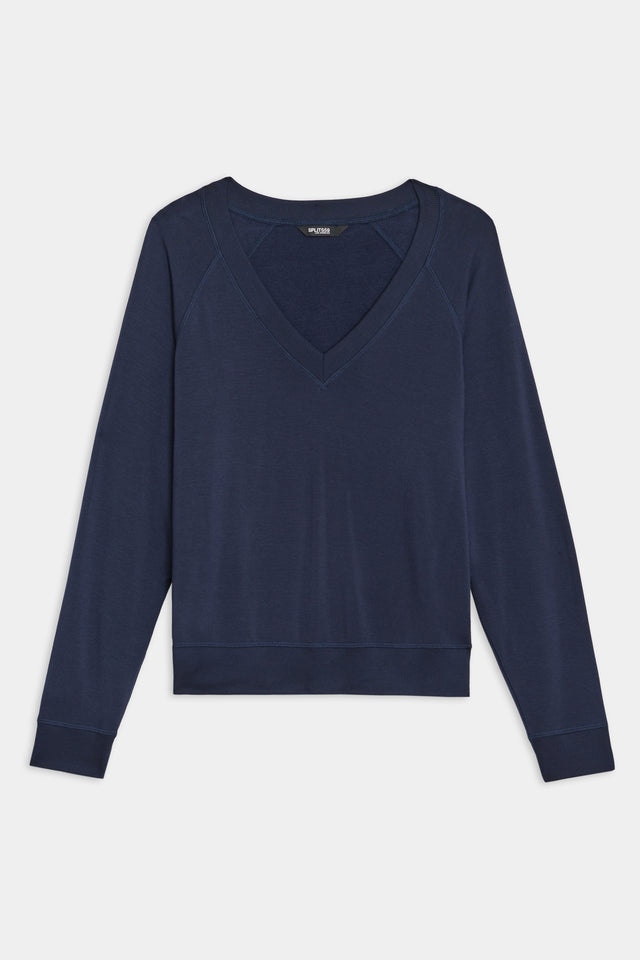 The SPLITS59 Bennie Fleece V-Neck Sweatshirt in indigo, featuring long sleeves and crafted in Los Angeles, is elegantly set against a white background.