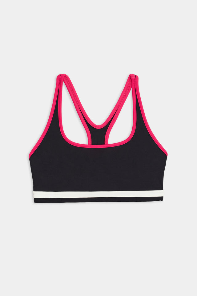 A Bianca Rigor Bra - Black and pink high-stretch nylon sports bra isolated on a white background by SPLITS59.