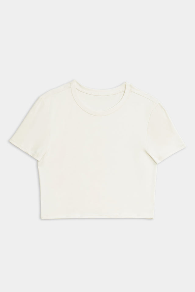 Airweight S/S Crop - White by SPLITS59 made of nylon-spandex fabric on a white background.
