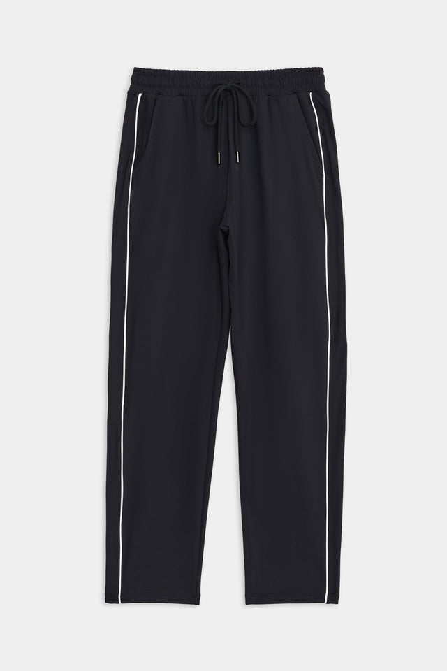 SPLITS59 Lucy Rigor Pant W/Piping - Black track pants with white side stripes, a drawstring waist, and high elasticity.