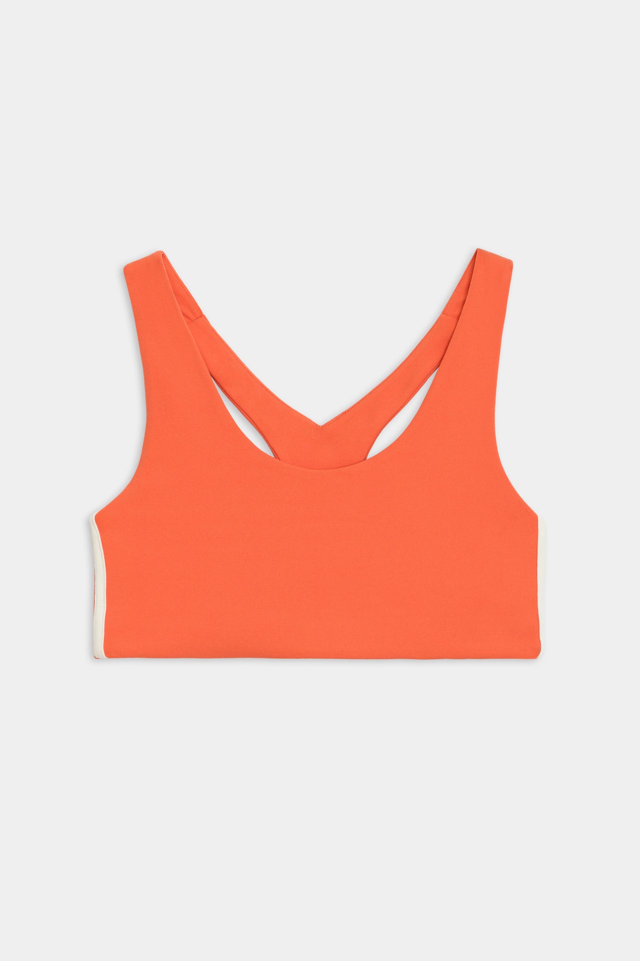 Flat view of orange sports bra with two thin white stripes 