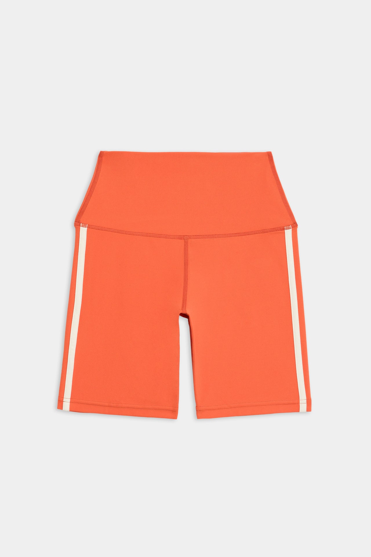 Flat view of orange bike shorts with two thin white stripes down the side