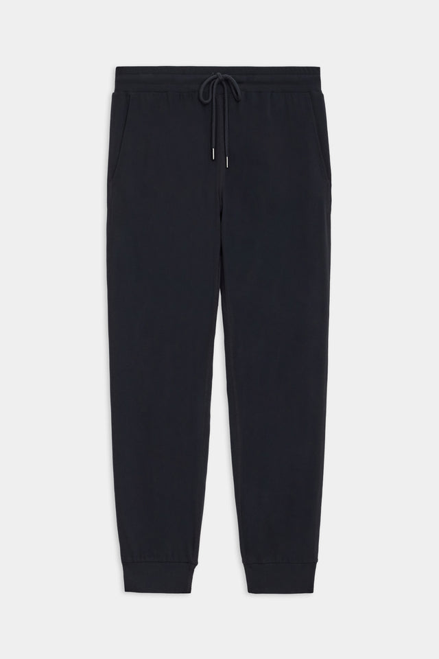 Flat view of view of black sweatpants with black tie around waistband 