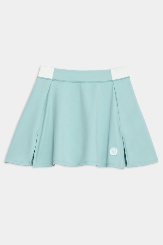 Front flat view of teal skort with white on the side waistbands and white logo