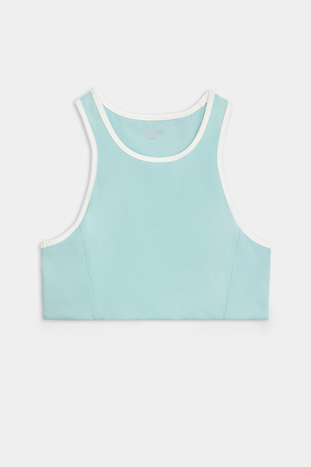 Flat view of light blue sports bra with white hem along the neck and arms