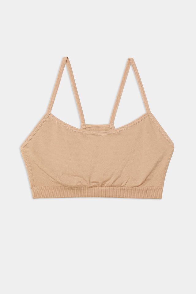 A Loren Seamless Bra in Nude on a white background from Splits59.
