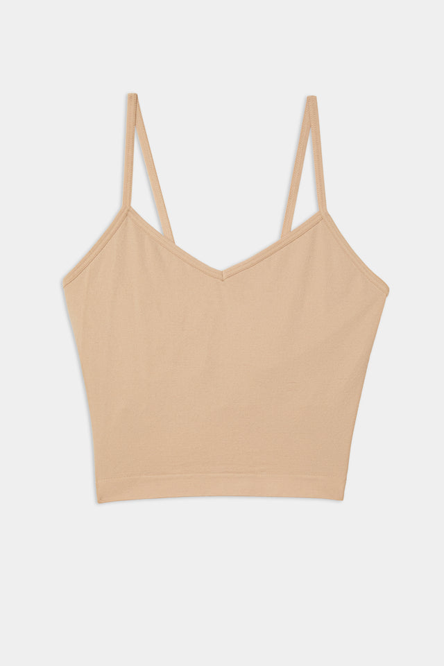 A Loren Seamless Cami - Nude with chafe-free fabric on a white background by Splits59.