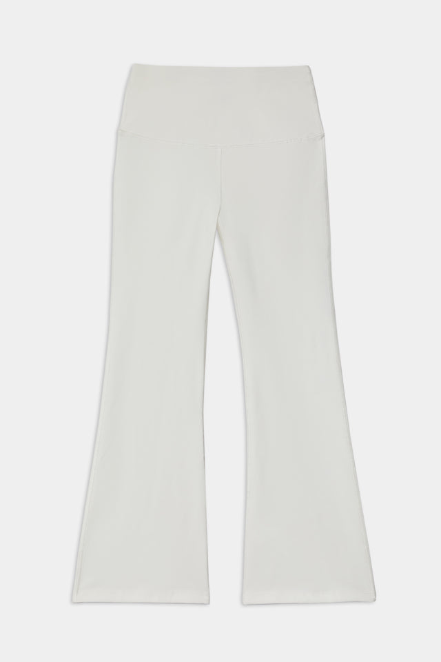 A pair of SPLITS59 Raquel High Waist Crop - White flared pants on a white background.