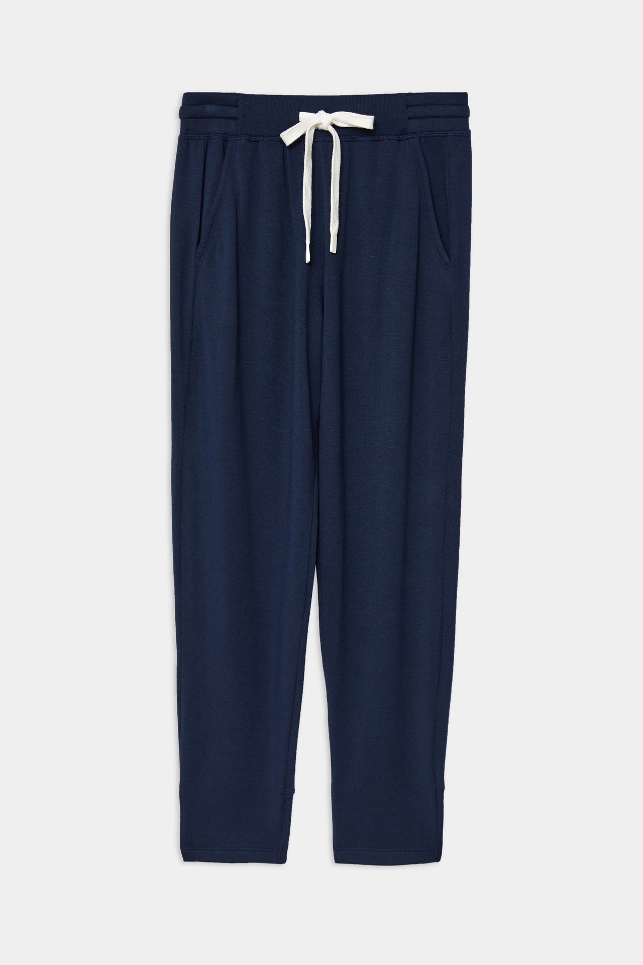Front flat view of dark blue sweatpant with tapered leg and above ankle length with white drawstring and side hip pockets