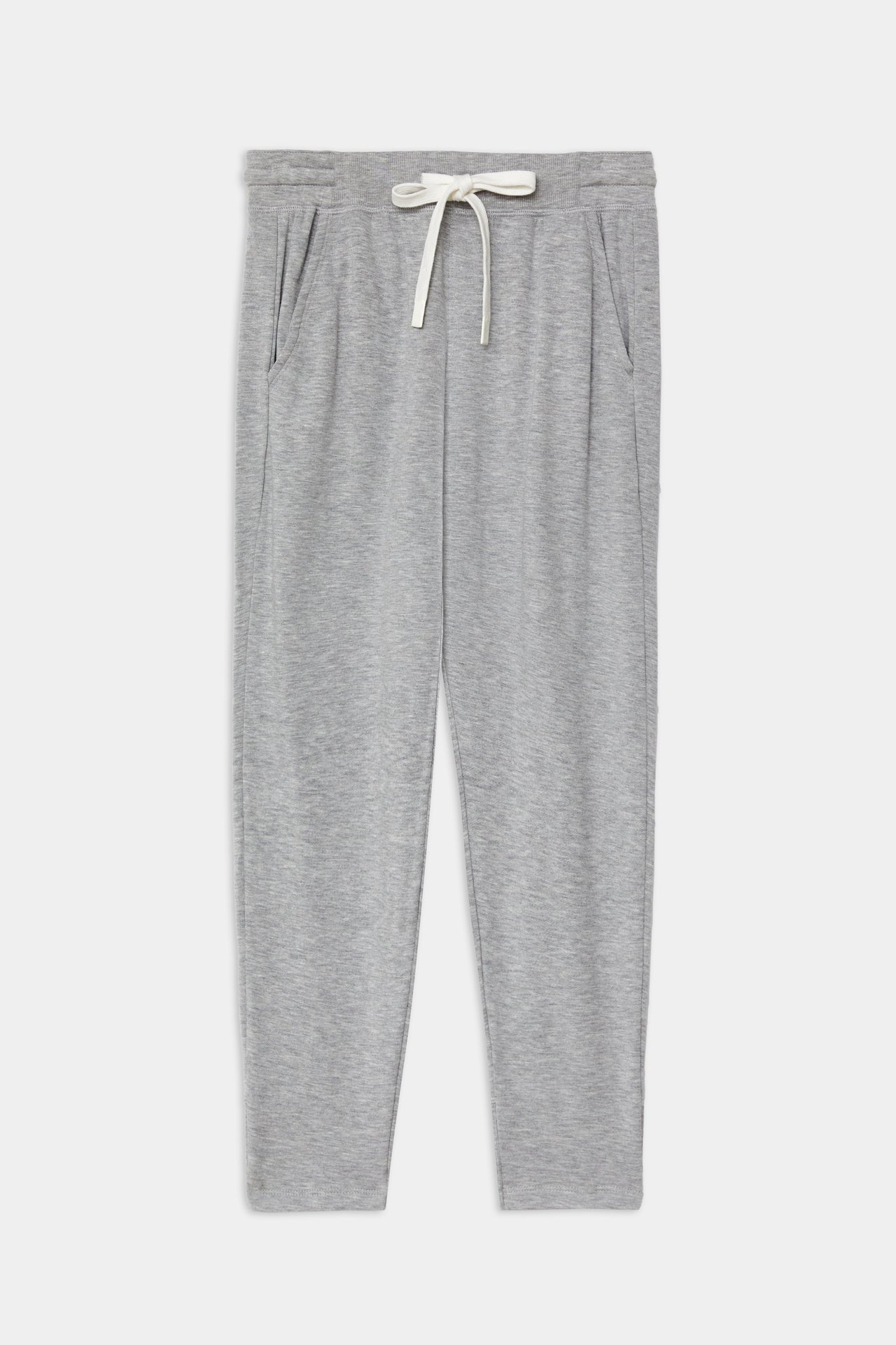 Front flat view of a light pale tone gray sweatpant with tapered leg and above ankle length with white drawstring and side hip pockets