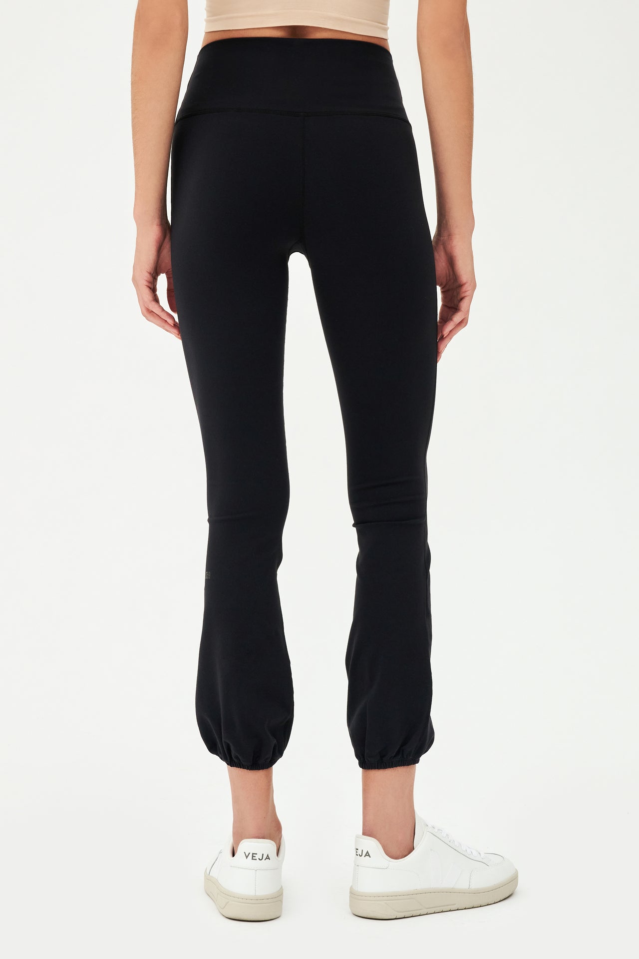 The back view of a woman wearing SPLITS59's Icon High Waist Supplex Legging in Black.