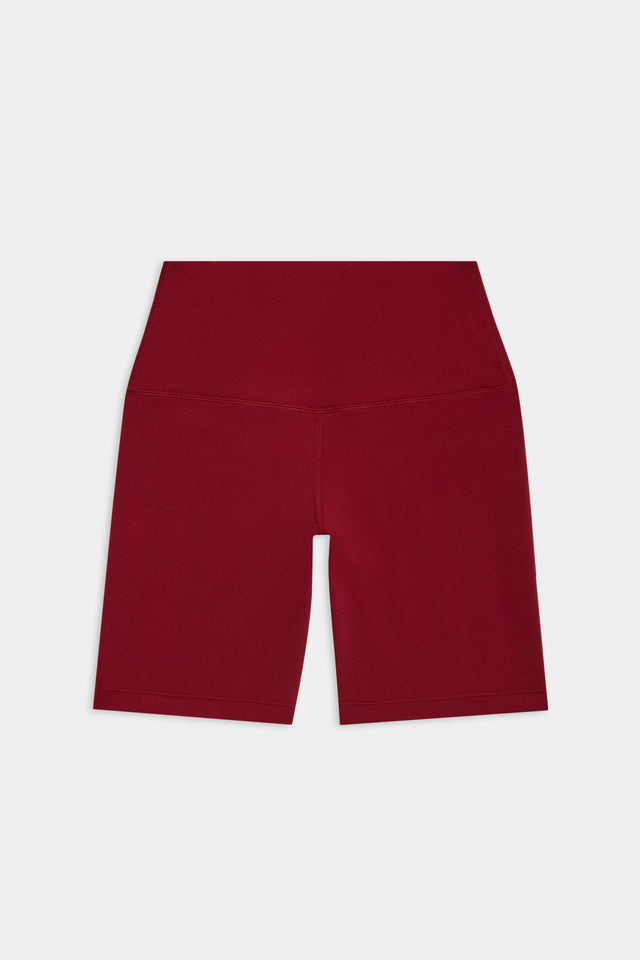 Flat view of deep red mid thigh bike shorts