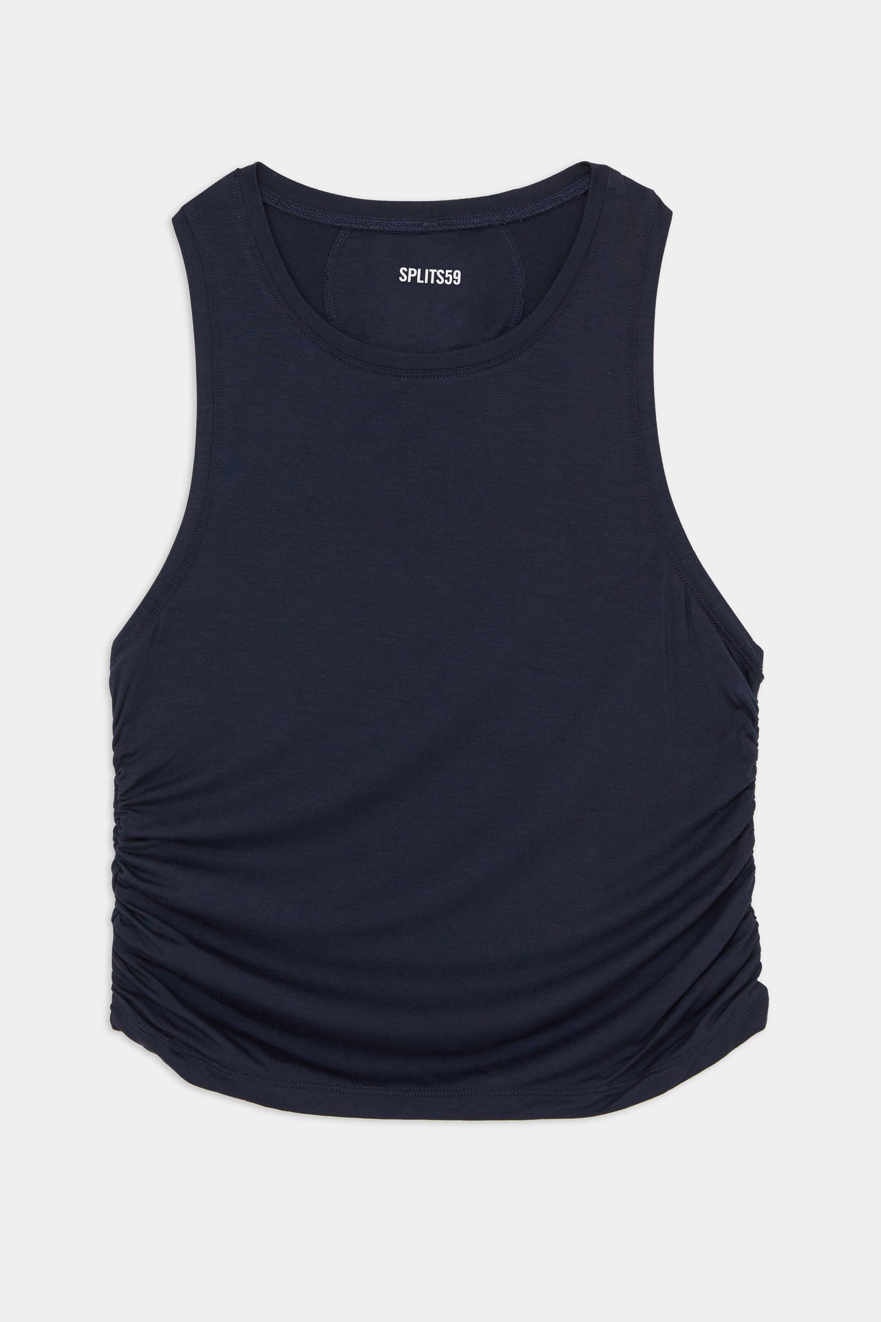 A cropped tank top with a ruched neckline, perfect for gym workouts. Try the Frida Jersey Tank in Indigo by SPLITS59.
